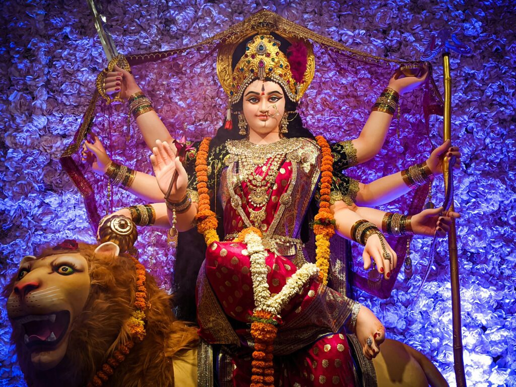 "Devotional Mata Ki Chowki featuring colorful rangoli and traditional offerings."
